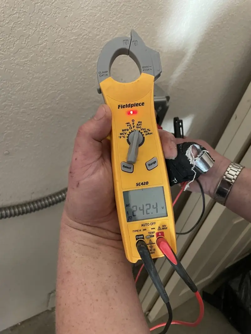 Voltage testing with clamp meter during Electrical Installation Services in Pennsville